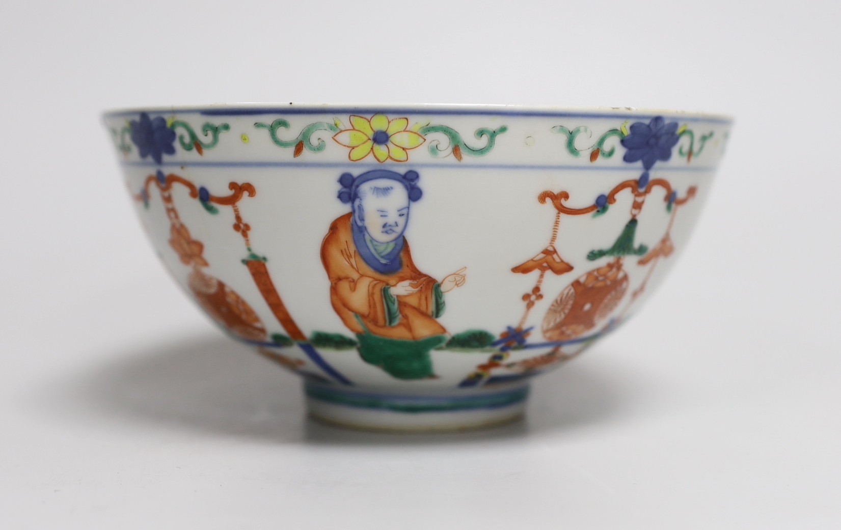 A Chinese wucai ‘boys’ bowl, Kangxi mark late 19th/early 20th century, dragon to the interior, 16.5cm diameter